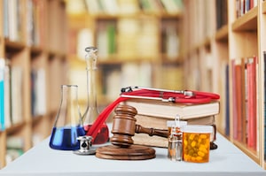 Gavel, and books in front of library shelves
